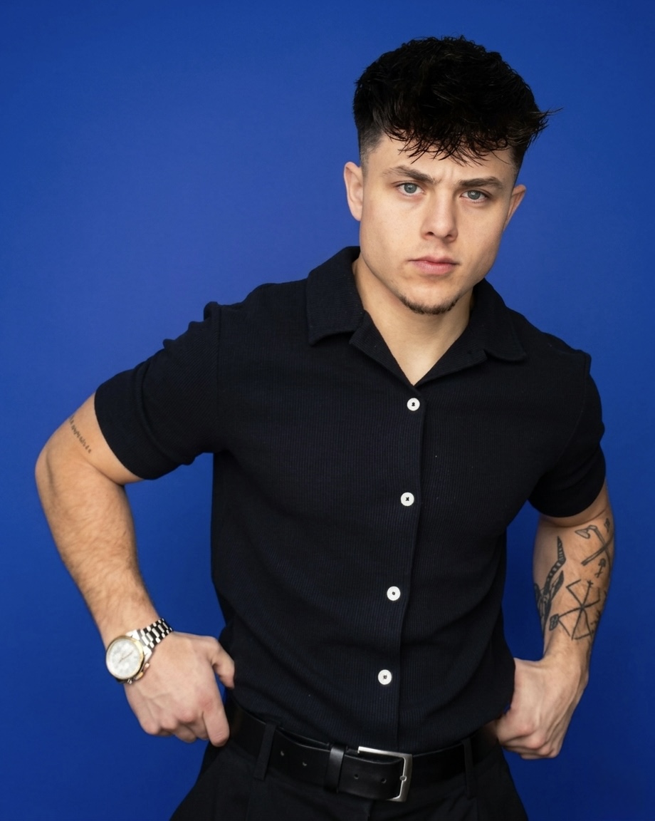 Studio portrait of Oliver Borch wearing a black shirt